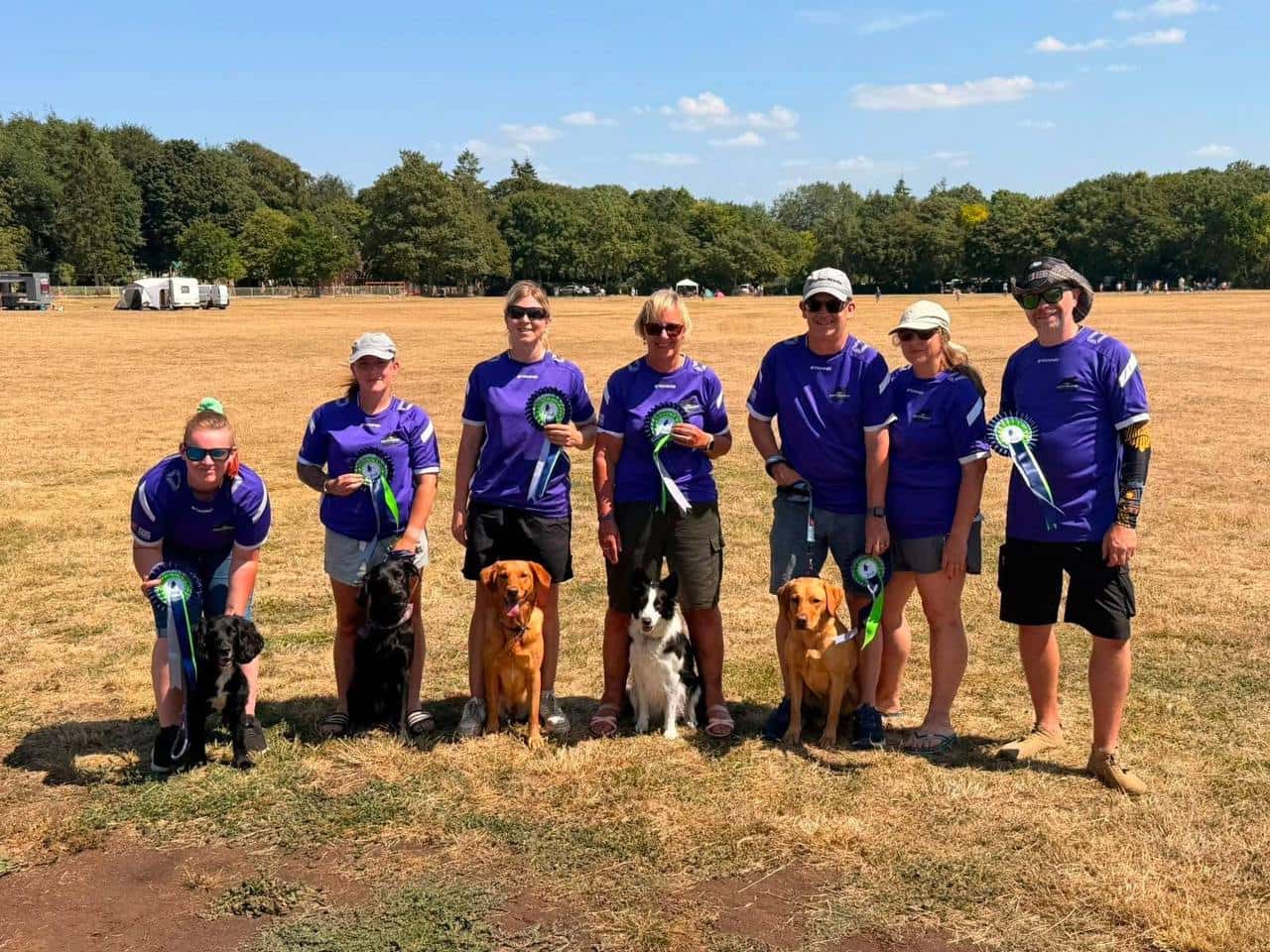 The Dartmoor Dashers team with their dogs and rosettes